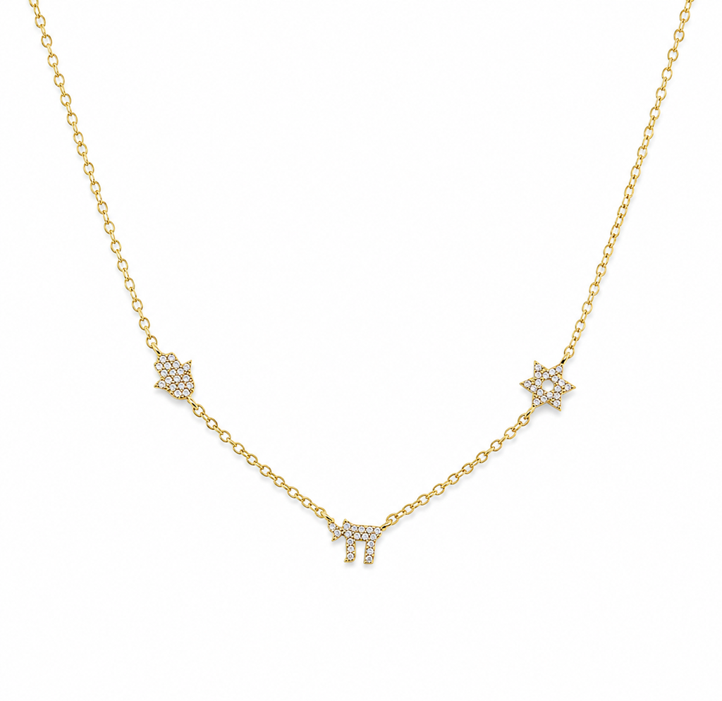 Gold tone 3 Pavé Charm Choker Necklace with Hamsa, Chai, and Star of David charms on a white background.