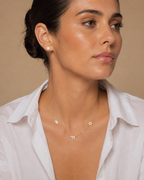Model wearing the gold tone 3 Pavé Charm Choker Necklace.