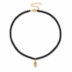 Adele Hamsa Beaded Necklace with black beads and gold tone Hamsa charm.