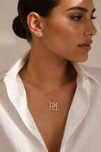 Model wearing the gold tone Ahava Love Necklace.