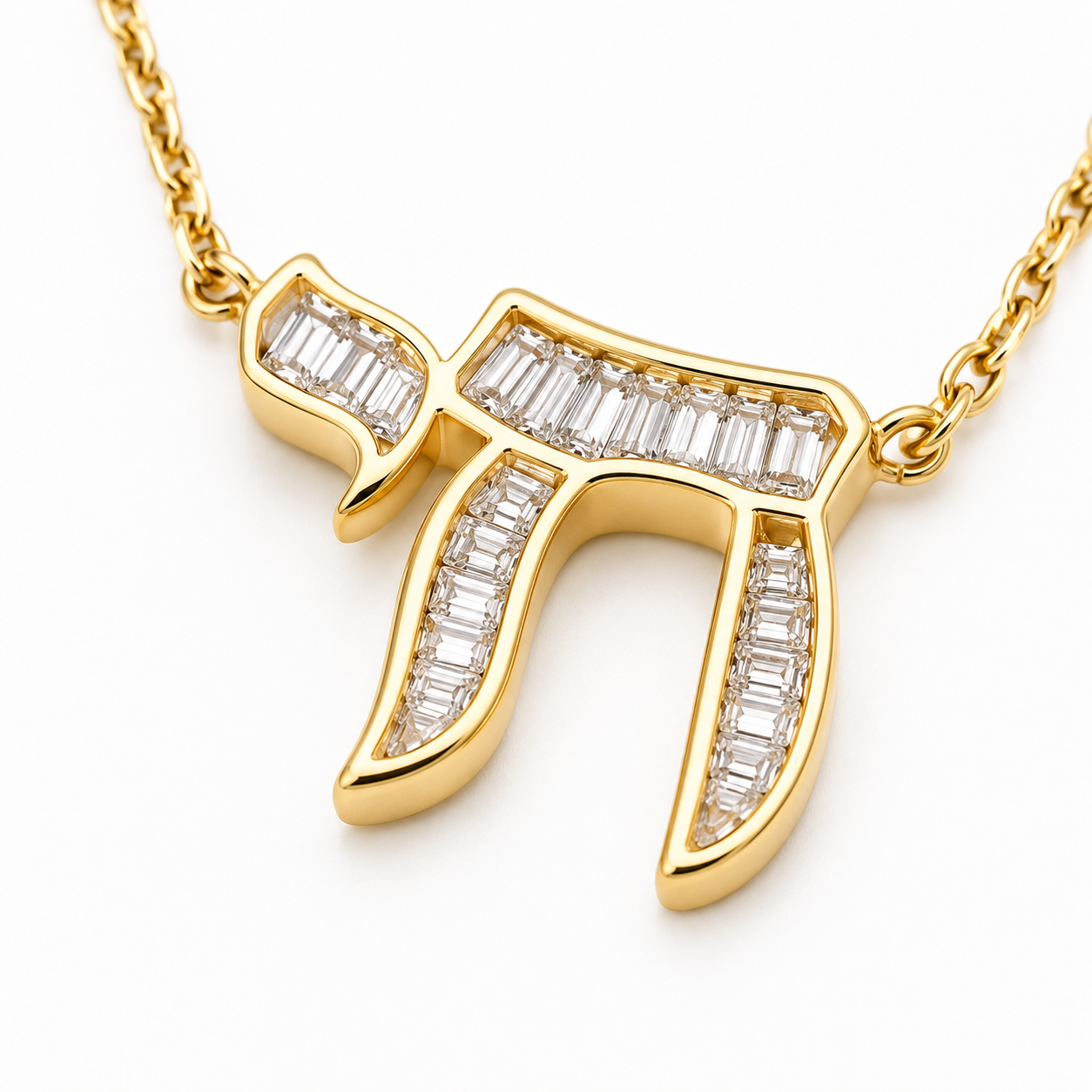 Close-up of the gold tone Baguette Chai pendant with cubic zirconia baguette stones.