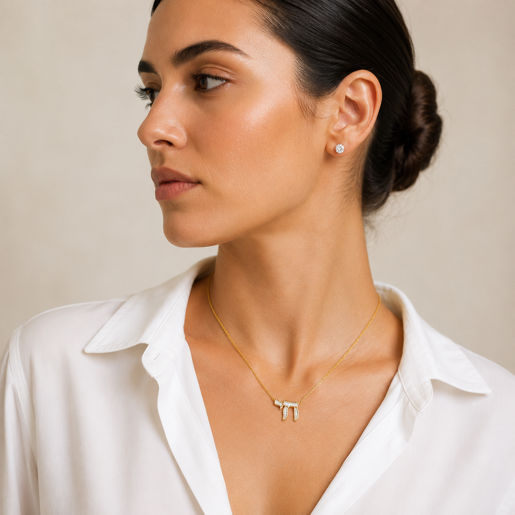 Model wearing the gold tone Baguette Chai Necklace.