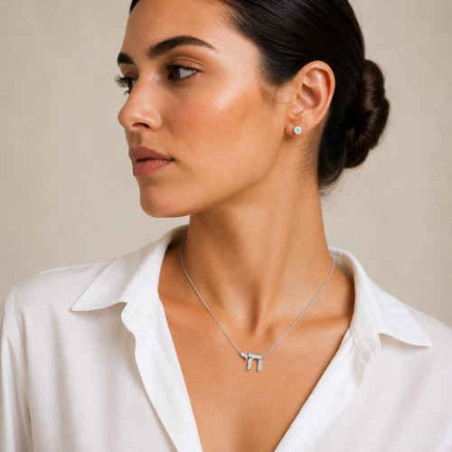 Model wearing the silver tone Baguette Chai Necklace.