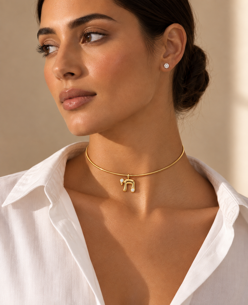 Model wearing the Bubble Chai Choker Necklace in gold tone.
