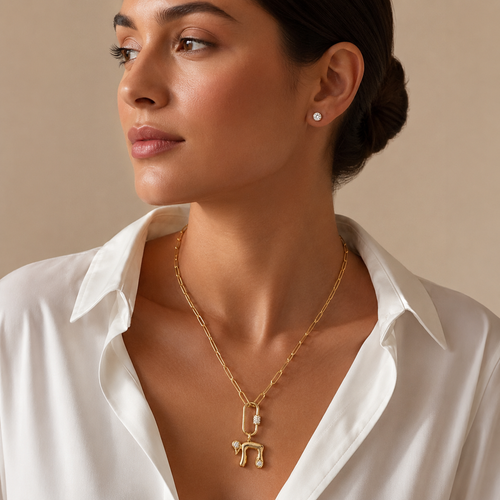 Model wearing the gold tone Bubble Chai Lariat Necklace.