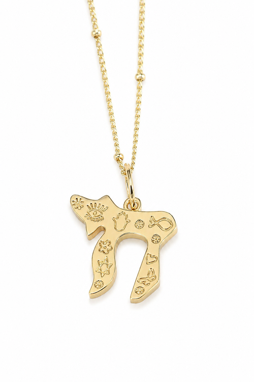 Gold tone Carved Chai Necklace with Star of David, Hamsa, Evil Eye, and fish symbols on a white background.