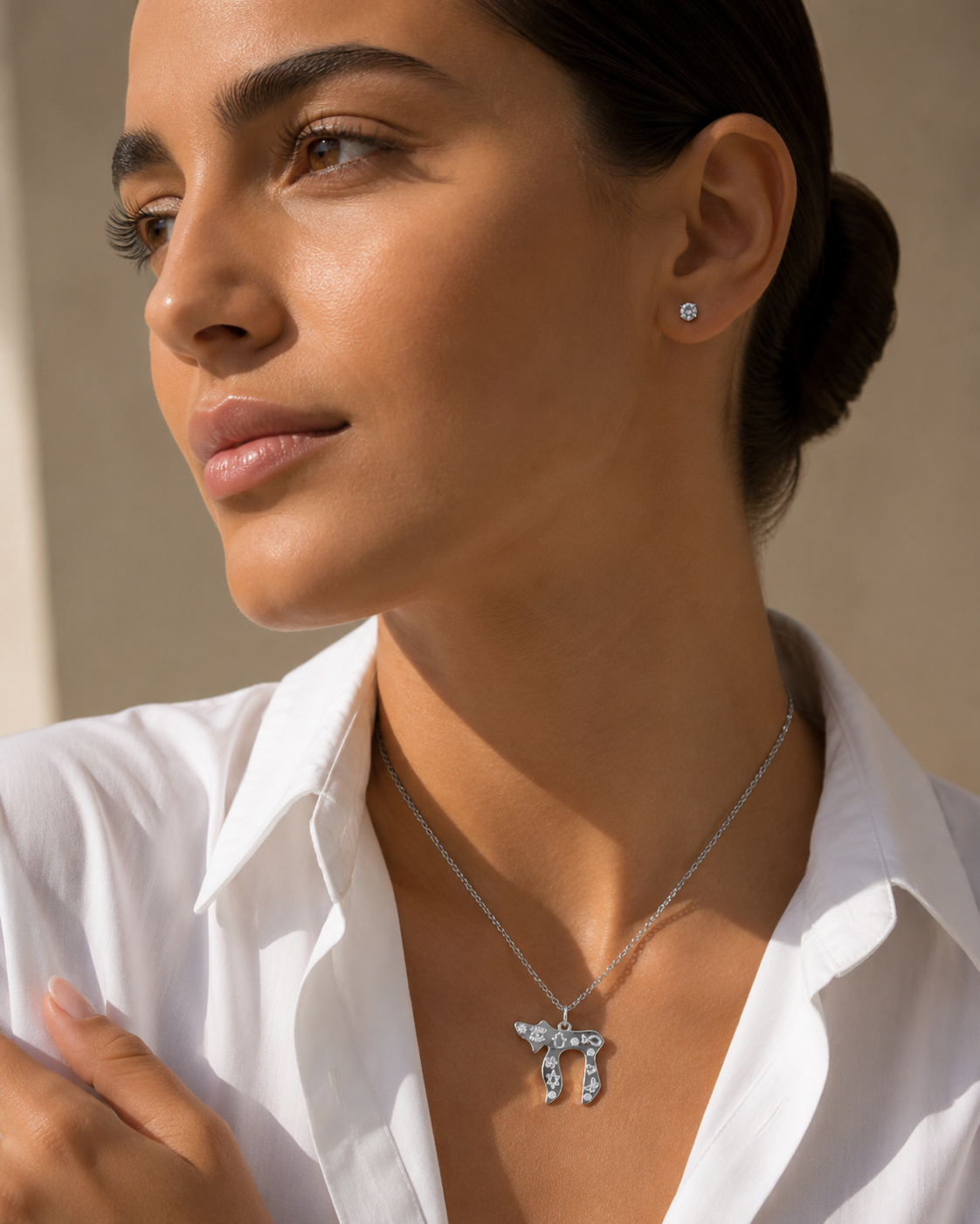 Model wearing the silver tone Carved Chai Necklace.