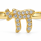 Close-up of gold tone Chai Pavé Ring with cubic zirconia stones
