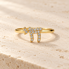 Gold tone Chai Pavé Ring on neutral stone surface