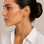 Model wearing the gold tone Chai Pavé Stud Earrings.