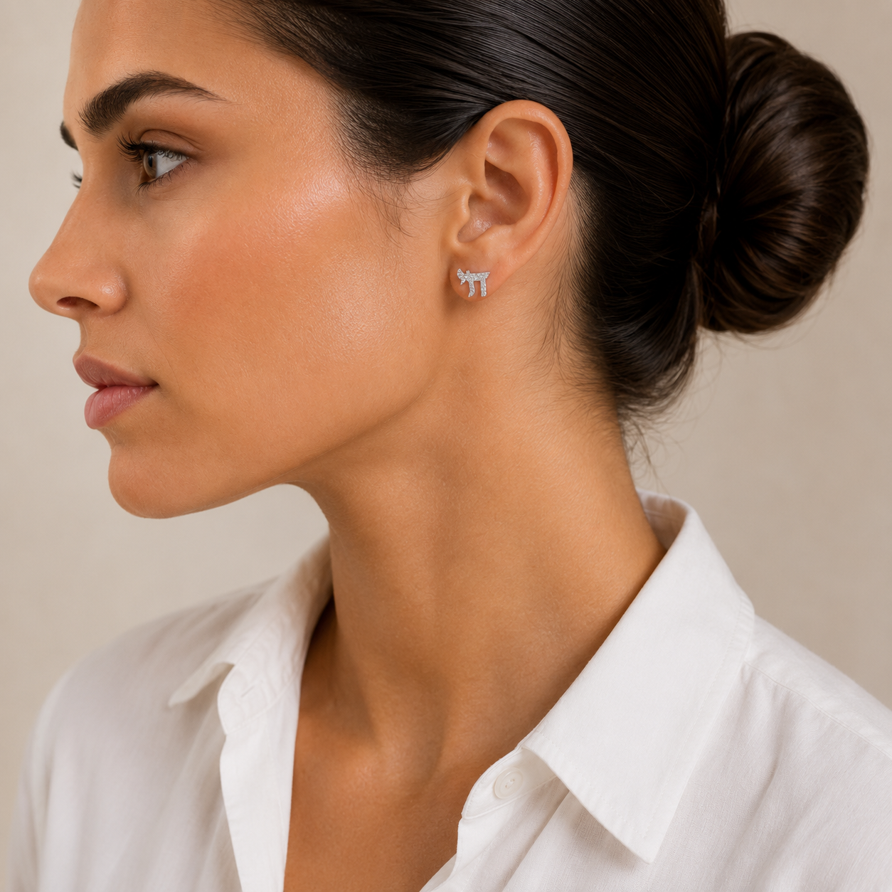 Model wearing the silver tone Chai Pavé Stud Earrings.