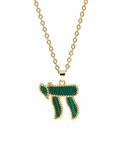 Gold tone Perlée Chai Necklace with green bead-like detailing on a white background.
