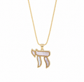 Gold tone Perlée Chai Necklace with white pearl-effect detailing on a white background.