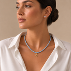 Model wearing the blue quartz Dead Sea Magen David necklace with gold tone pendant.