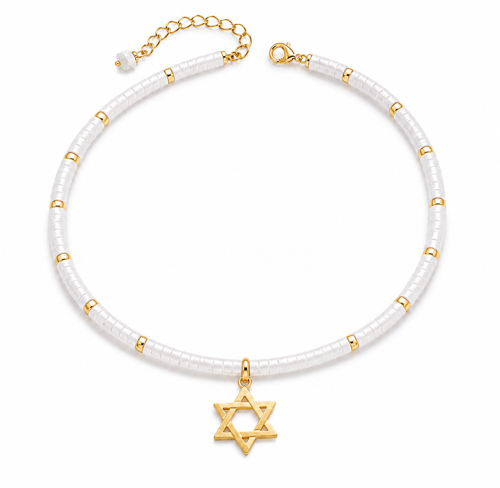 Clear quartz Dead Sea Magen David necklace with gold tone Star of David pendant on a white background.