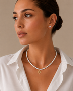 Model wearing the clear quartz Dead Sea Magen David necklace.