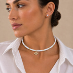 Woman wearing the Eden Evil Eye Beaded Choker Necklace with white quartz gemstone beads.