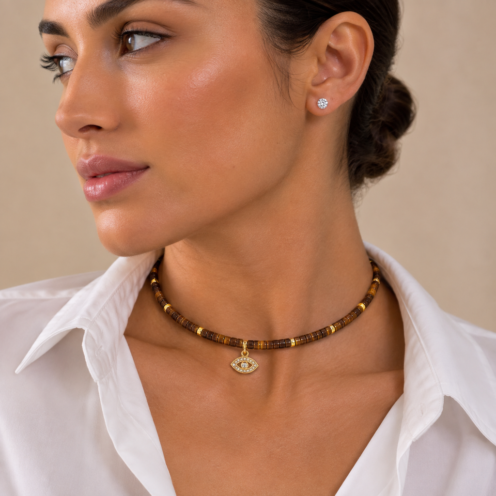 Woman wearing the Eden Evil Eye Beaded Choker Necklace with Tiger's Eye gemstone beads.
