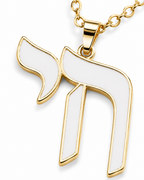Close-up of the gold tone Chai pendant with smooth white enamel detailing.