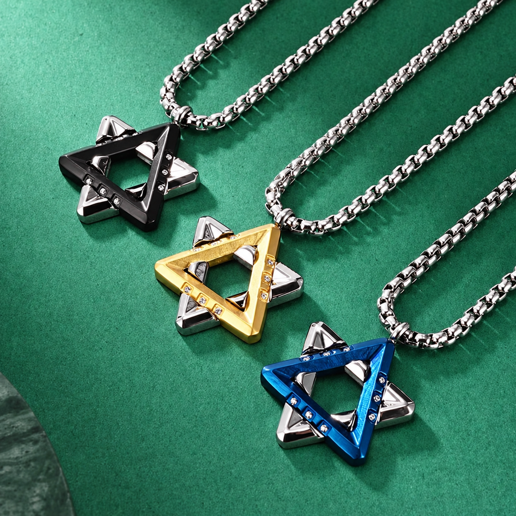 Ezra Star of David necklaces in black, gold tone, and blue with silver-tone chains arranged diagonally on green felt.