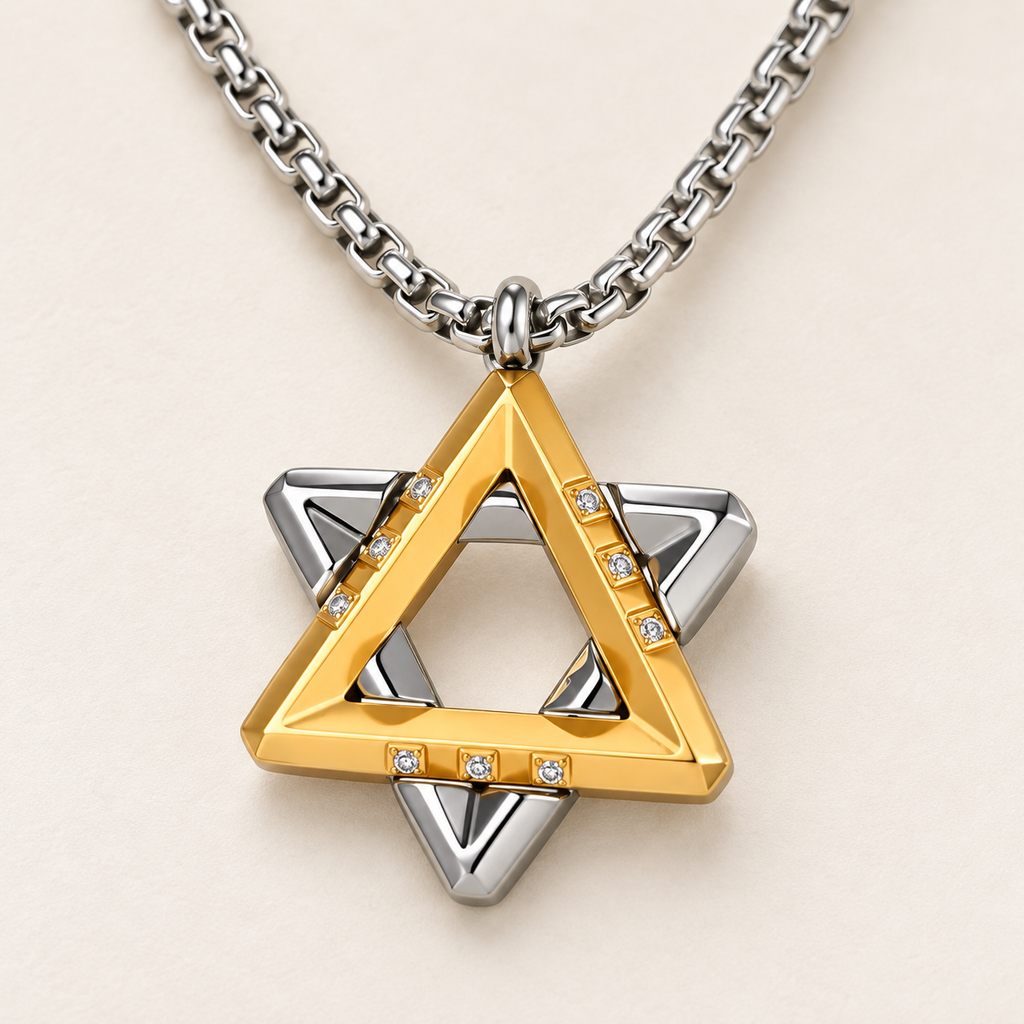 Close-up of the Ezra gold-tone Star of David pendant showing layered triangles and cubic zirconia accents.