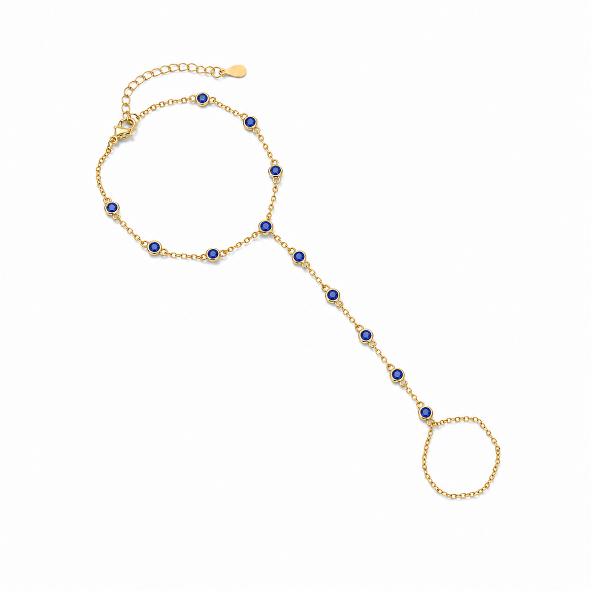 Gold tone Hava CZ Hand Chain with sapphire-colored cubic zirconia on a white background.