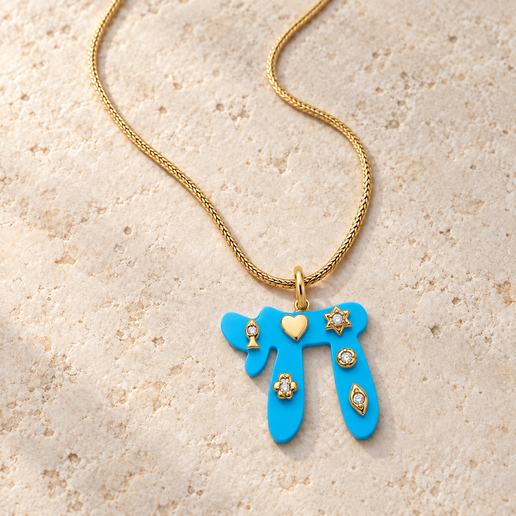 Turquoise Lucky Chai Necklace arranged on pale textured stone in soft natural light.