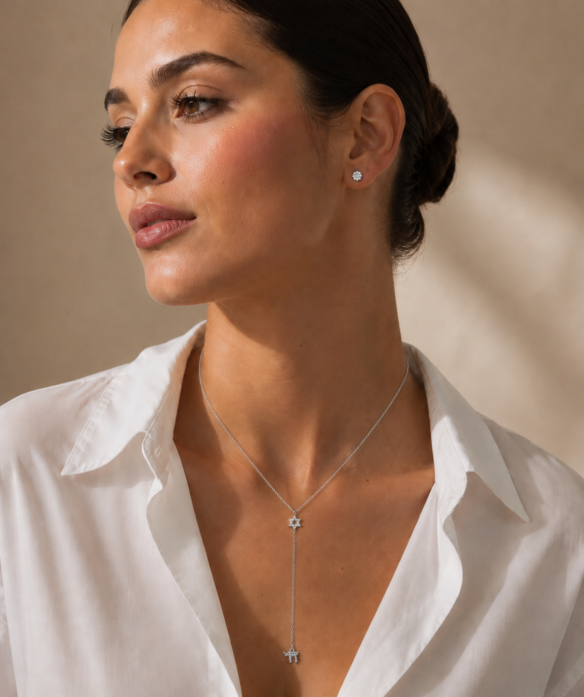 Model wearing the silver tone Magen David Lariat Necklace.