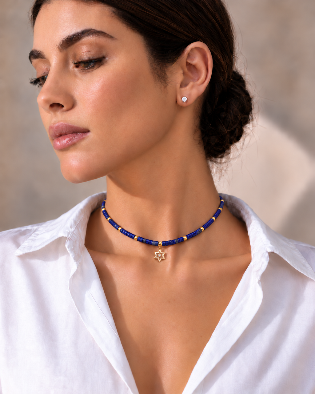 Model wearing Noa Star of David Beaded Choker Necklace in Lapis.