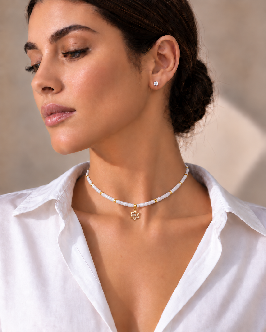 Model wearing Noa Star of David Beaded Choker Necklace in White Quartz.