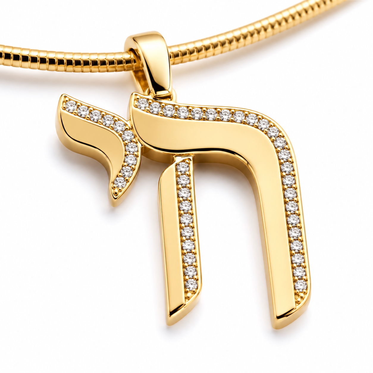 Close-up of the gold tone Chai pendant outlined in pavé-set stones.