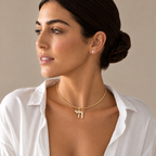 Model wearing Outline Pavé Chai Collar Necklace in Gold Tone.