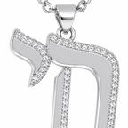 Close-up of the silver tone Outline Pavé Chai pendant with pavé-set stones.