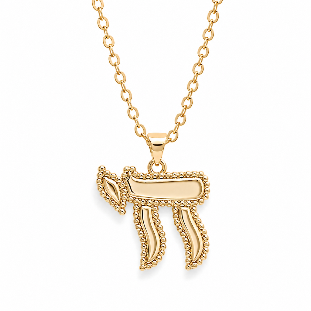 Gold tone Perlée Chai Necklace with bead-like detailing on a white background.