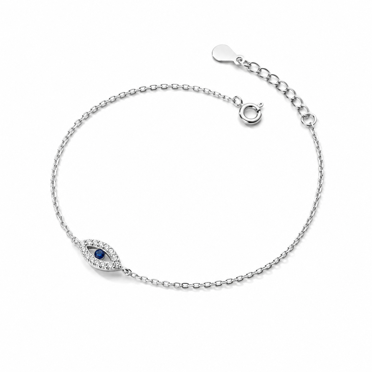 Silver tone Petite Evil Eye Bracelet with a blue center and sparkling stone accents on a white background.