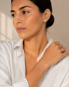 Model wearing the silver tone Petite Evil Eye Bracelet.