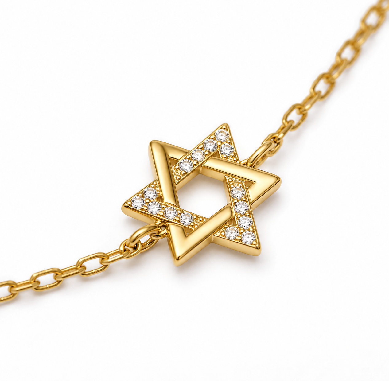 Close-up of the gold tone 9.5 mm Star of David charm on the Petite Magen David Bracelet.