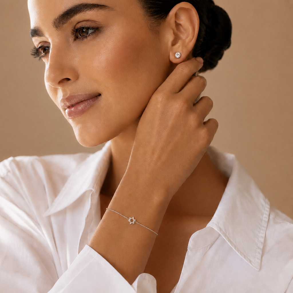Model wearing the silver tone Petite Magen David Bracelet.