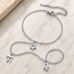 Silver tone Protection • Identity • Life Hand Chain styled on a neutral stone surface.