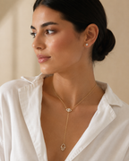 Model wearing the gold tone Protection Lariat Necklace.