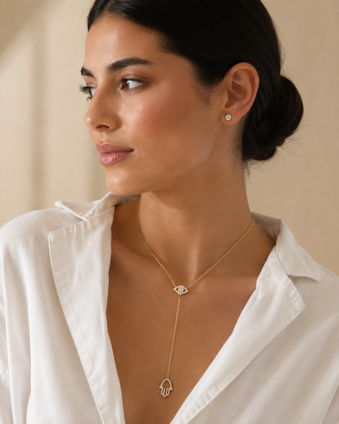 Model wearing the gold tone Protection Lariat Necklace.