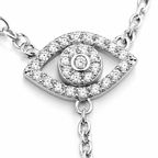 Close-up of the pavé Evil Eye charm on the silver tone Protection Lariat Necklace.