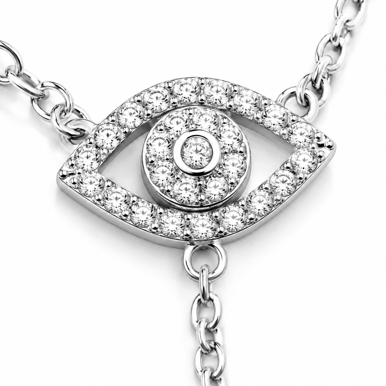 Close-up of the pavé Evil Eye charm on the silver tone Protection Lariat Necklace.