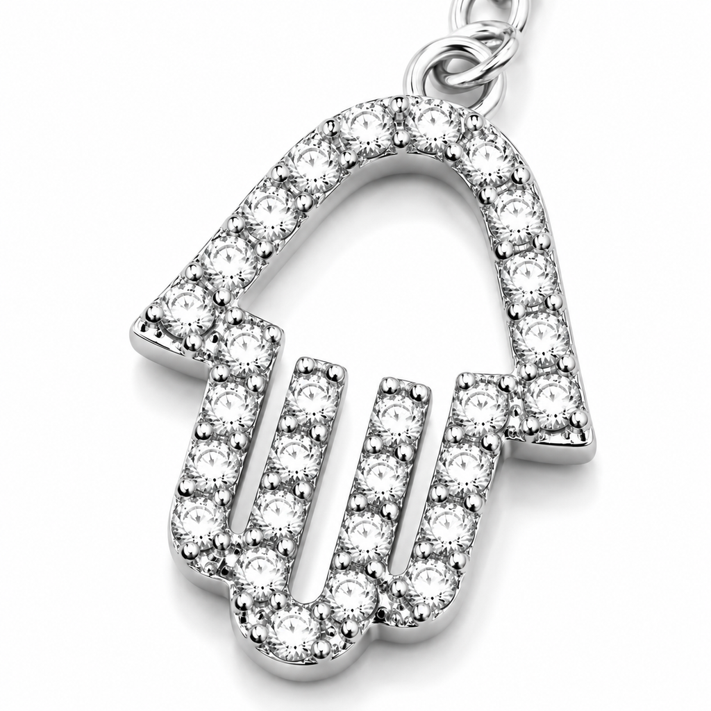 Close-up of the pavé Hamsa charm on the silver tone Protection Lariat Necklace.