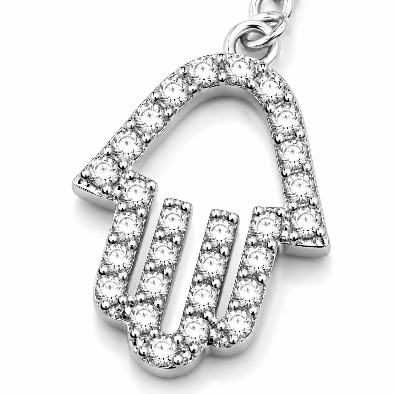 Close-up of the pavé Hamsa charm on the silver tone Protection Lariat Necklace.
