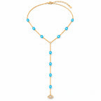Blue See No Evil Lariat Necklace with a gold tone chain and pavé CZ evil eye charm on a white background.