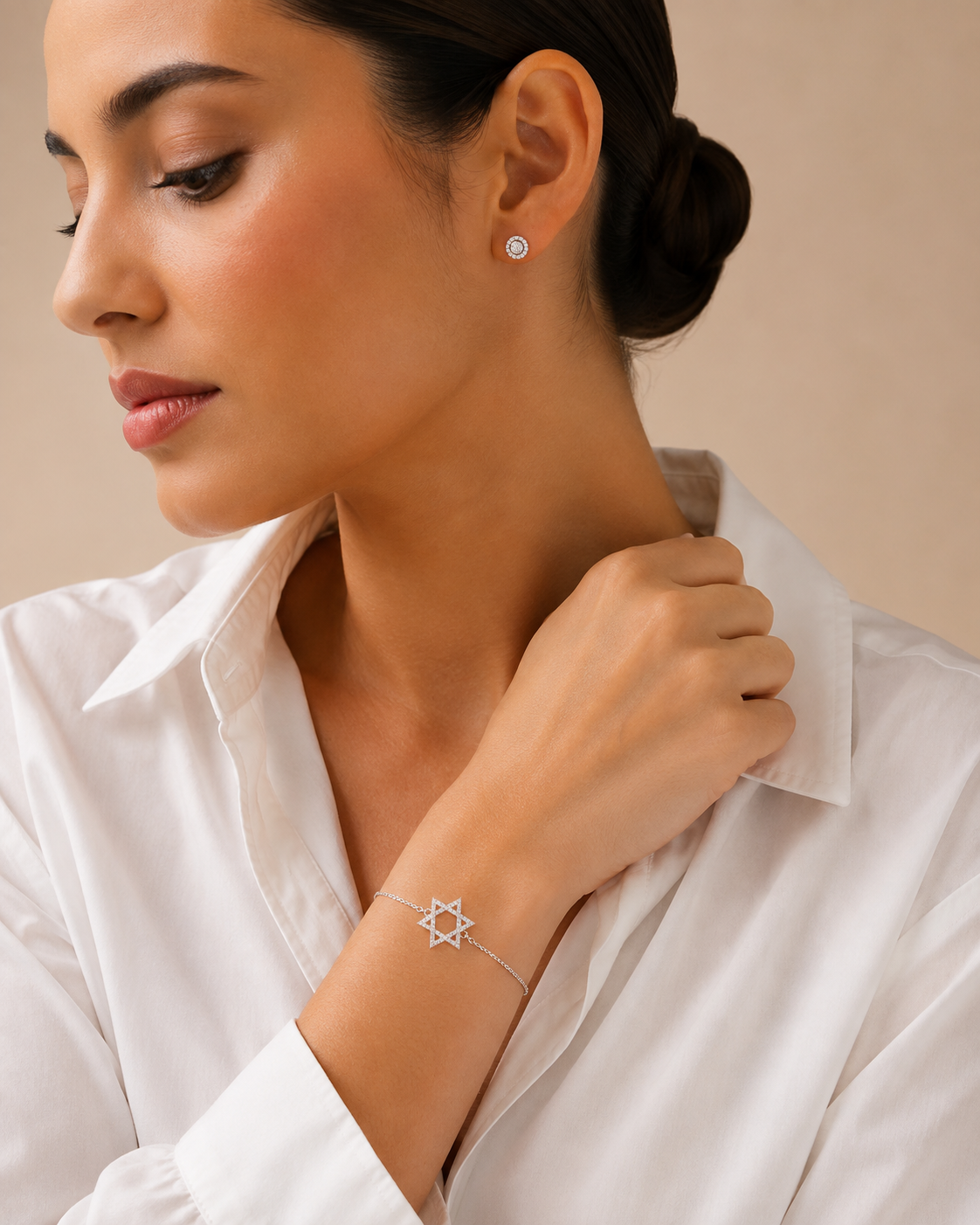 Model wearing the Silver Tone Star of David Bracelet with a pavé-set cubic zirconia Star of David charm.