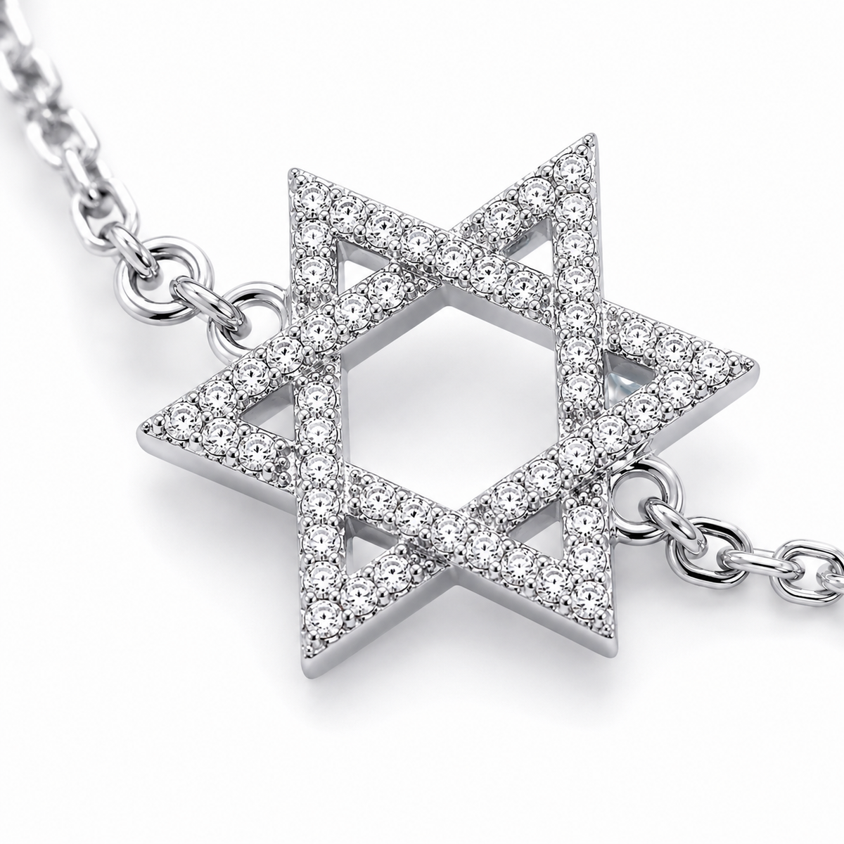 Close-up of the pavé-set cubic zirconia Star of David charm on the Silver Tone Star of David Bracelet.